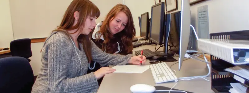 Writing Lab tutor helping a student