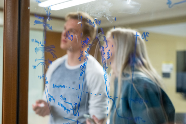 Snow College students writing math equations