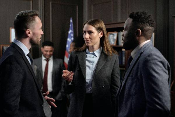 Multiple people in a business setting having a conversation