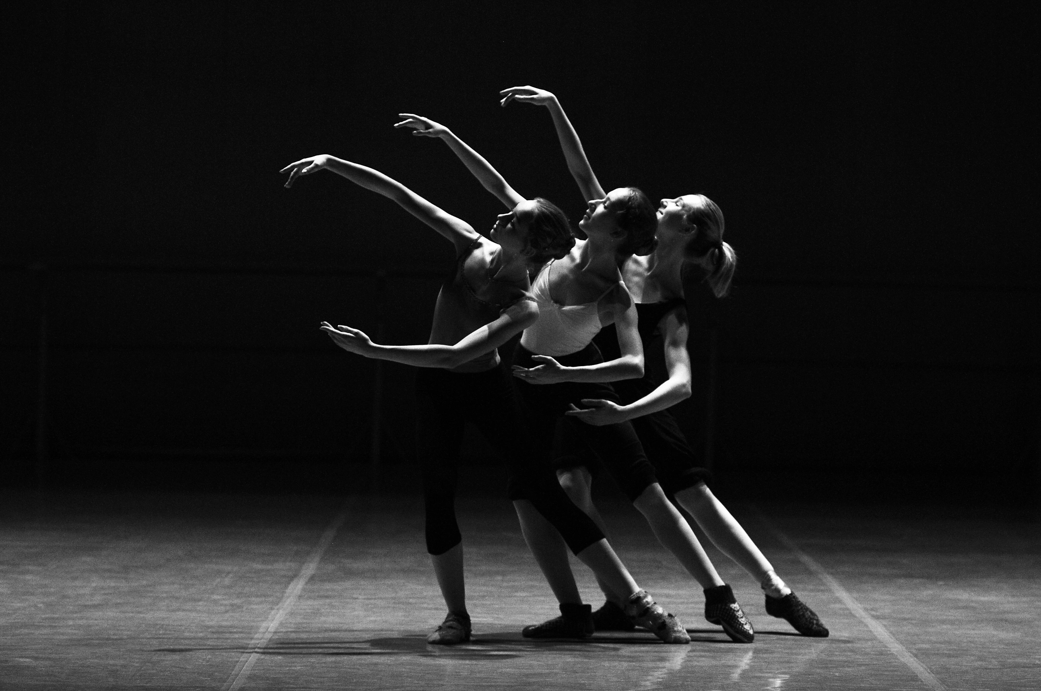 Multiple people in the middle of a dance performance.