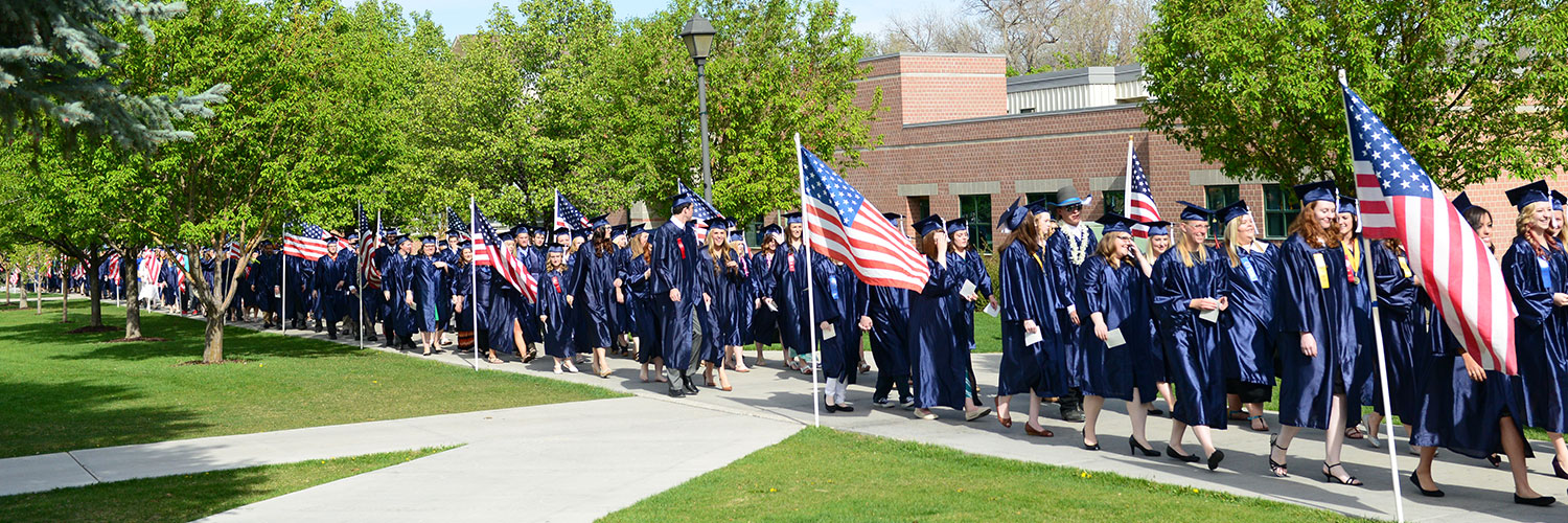 Graduating students walking past the Humanities building