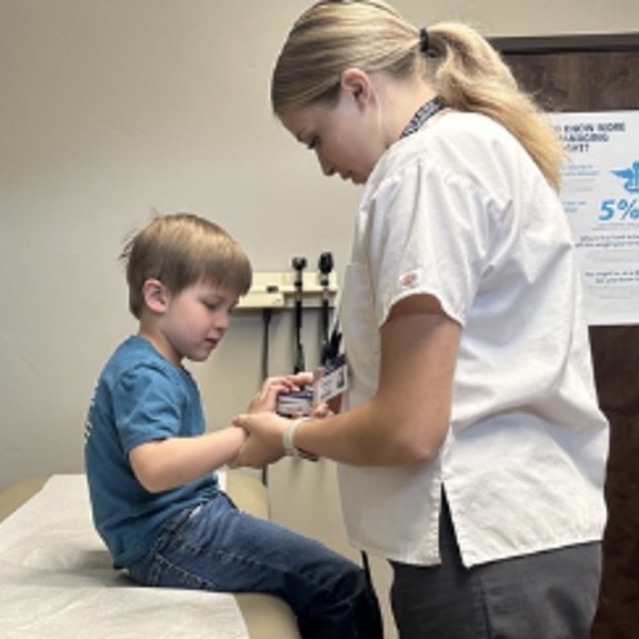Medical Assistant with a patient